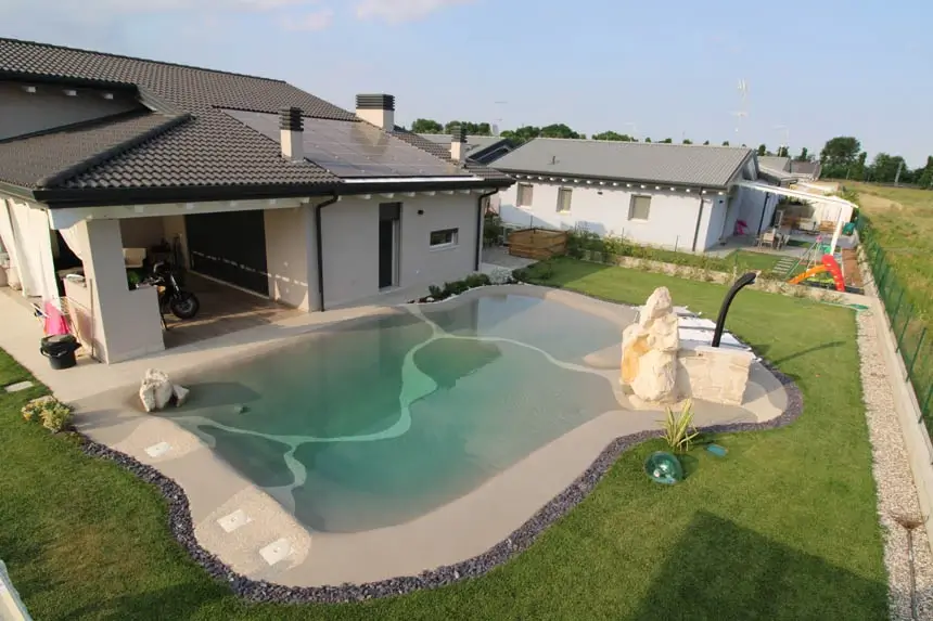 Completed beach pool beside a family home